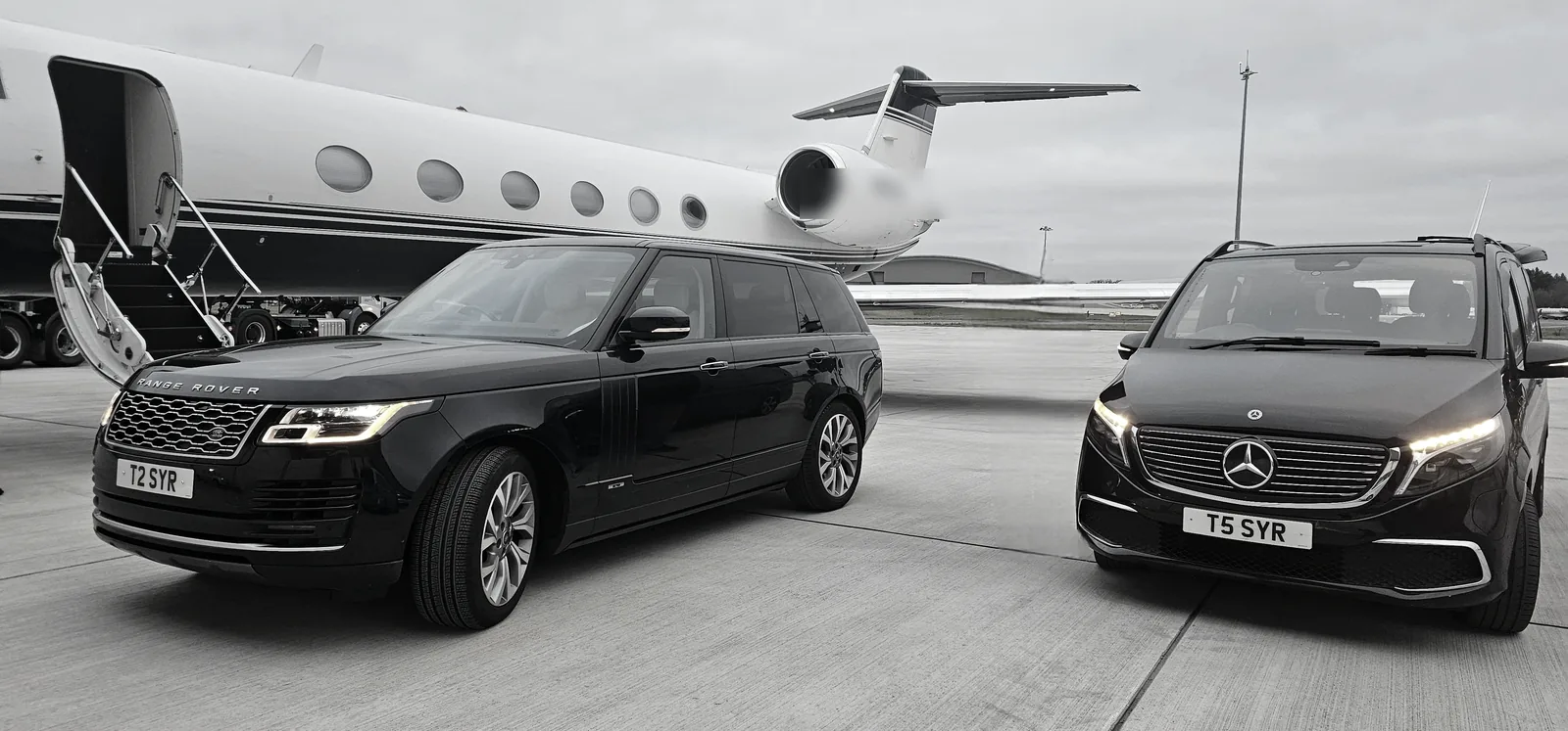 A chauffeur crossing the apron toward a waiting private aircraft.